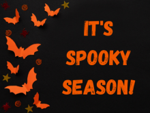 Black and orange image with bats saying "it's spooky season!"